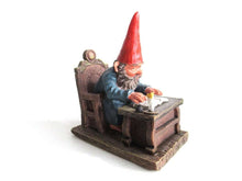UpperDutch:,Classic Gnomes 'Rien' Gnome figurine after a design by Rien Poortvliet, Gnome reading by candlelight.