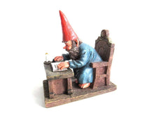 UpperDutch:,Classic Gnomes 'Rien' Gnome figurine after a design by Rien Poortvliet, Gnome reading by candlelight.