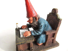UpperDutch:,Classic Gnomes 'Rien' Gnome figurine after a design by Rien Poortvliet, Gnome reading by candlelight.