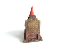 UpperDutch:,Classic Gnomes 'Rien' Gnome figurine after a design by Rien Poortvliet, Gnome reading by candlelight.