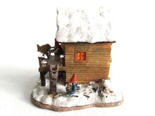 UpperDutch:,Classic Gnomes Villages 'House with Wren' after a design by Rien Poortvliet, feeding bird.