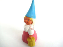 UpperDutch:Gnome,Gnome figurine in pink dress, Gnome after a design by Rien Poortvliet, Brb Gnome, Lisa the Gnome carrying a bucket.