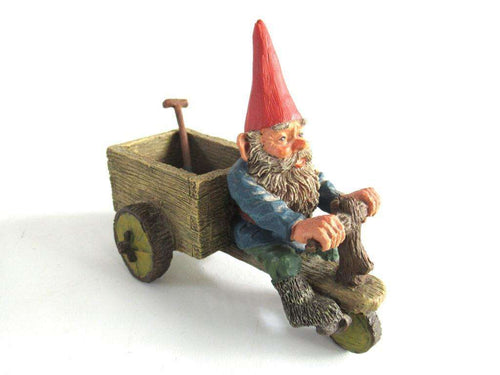 UpperDutch:,Gnome 'Thomas' riding a cargo bike with shovel. Gnome figurine after a design by Rien Poortvliet. Classic Gnomes series. AAAAAAA International Co. Ltd.