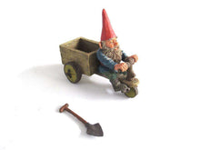 UpperDutch:,Gnome 'Thomas' riding a cargo bike with shovel. Gnome figurine after a design by Rien Poortvliet. Classic Gnomes series. AAAAAAA International Co. Ltd.