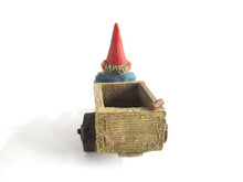 UpperDutch:,Gnome 'Thomas' riding a cargo bike with shovel. Gnome figurine after a design by Rien Poortvliet. Classic Gnomes series. AAAAAAA International Co. Ltd.