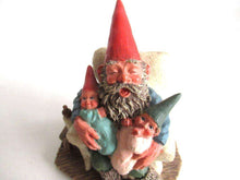 UpperDutch:,'Grandfather with Children' Gnome with grandchildren sitting in a chair figurine. Part of the Classic Gnomes series designed by Rien Poortvliet
