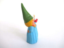 UpperDutch:Gnome,Lisa the Gnome after a design by Rien Poortvliet, Holding a candle. Blue night gown, Pajamas. BRB