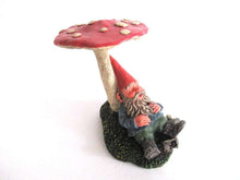 UpperDutch:,'Slumber Chief' a design by Rien Poortvliet. Gnome sleeping under a mushroom. Dutch Classic gnomes series. AAAAAAA International Co. Ltd.