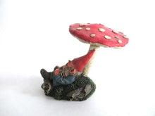 UpperDutch:,'Slumber Chief' a design by Rien Poortvliet. Gnome sleeping under a mushroom. Dutch Classic gnomes series. AAAAAAA International Co. Ltd.