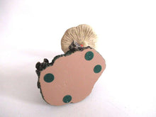 UpperDutch:,'Slumber Chief' a design by Rien Poortvliet. Gnome sleeping under a mushroom. Dutch Classic gnomes series. AAAAAAA International Co. Ltd.