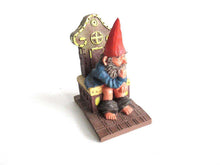 UpperDutch:,'Theodor' Gnome figurine after a design by Rien Poortvliet. Gnome on the toilet. Dutch Classic Gnomes series. AAAAAAA International Co. Ltd.