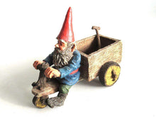 UpperDutch:,'Thomas' Gnome riding a cargo bike with shovel. Gnome figurine after a design by Rien Poortvliet. Classic Gnomes series. AAAAAAA International Co. Ltd.