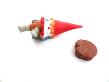 UpperDutch:Gnomes,Gnome, miniature Gnome after a design by Rien Poortvliet, Brb Gnome, David the Gnome, reading gnome sitting on a tree trunk.