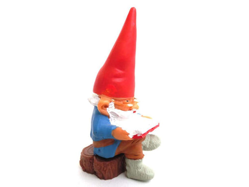 UpperDutch:Gnomes,Gnome, miniature Gnome after a design by Rien Poortvliet, Brb Gnome, David the Gnome, reading gnome sitting on a tree trunk.