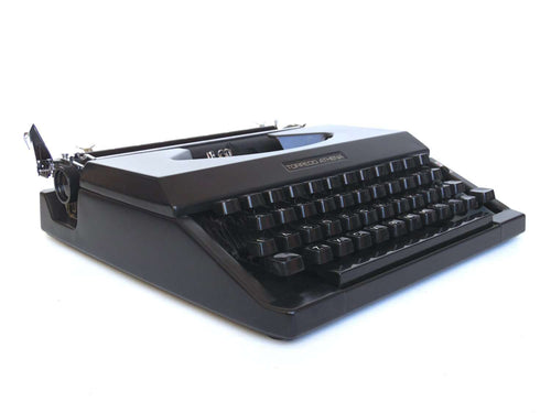 UpperDutch:Typewriter,Working Typewriter 1970's Matte black Torpedo Athena, QWERTY keyboard. Made in the 1970s. Man cave desk accessoire decoration.