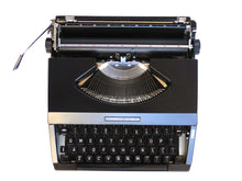 UpperDutch:Typewriter,Working Typewriter 1970's Matte black Torpedo Athena, QWERTY keyboard. Made in the 1970s. Man cave desk accessoire decoration.