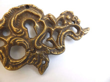 UpperDutch:Hooks and Hardware,Antique Brass Keyhole cover, escutcheon, keyhole frame plate, floral.