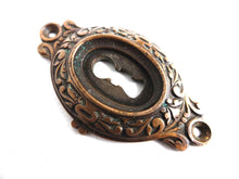 UpperDutch:Hooks and Hardware,Antique Brass Keyhole cover, escutcheon, keyhole frame plate, floral.