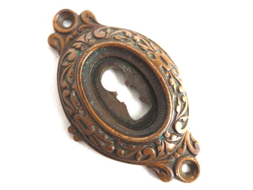 UpperDutch:Hooks and Hardware,Antique Brass Keyhole cover, escutcheon, keyhole frame plate, floral.