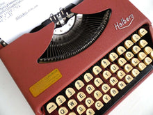 UpperDutch:Typewriter,Working Typewriter 1950's Halberg. QWERTY keyboard. 1953, rare typewriter. Portable Pink Halberg typewriter.
