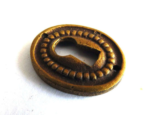 UpperDutch:Hooks and Hardware,1 (ONE) small Oval Keyhole cover, Antique brass escutcheon, key hole frame, plate.