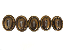 UpperDutch:Hooks and Hardware,1 (ONE) small Oval Stamped Keyhole cover, Antique brass escutcheon, key hole frame, plate.