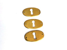 UpperDutch:Hooks and Hardware,1 (ONE) Stamped Keyhole cover, oval brass stamped escutcheon key hole frame / plate.