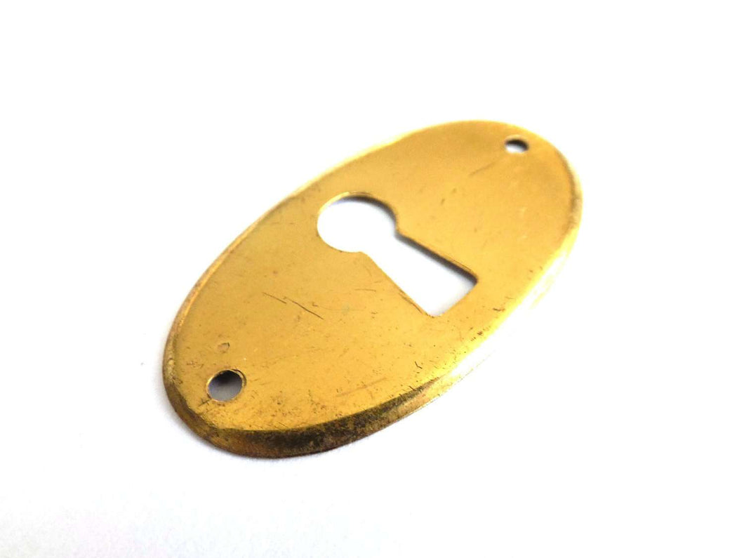 UpperDutch:Hooks and Hardware,1 (ONE) Stamped Keyhole cover, oval brass stamped escutcheon key hole frame / plate.