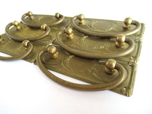 UpperDutch:Hooks and Hardware,1 (ONE) Old cabinet pull escutcheon with laurel design. NOS Brass Antique Drawer Handle with hanging pull. Restoration hardware.