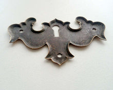 UpperDutch:Hooks and Hardware,Escutcheon, Stamped Keyhole cover, plate.