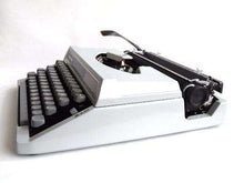 UpperDutch:Typewriter,Typewriter Silver-Reed 100, working gray portable typewriter 1970s Japan, QWERTY, Retro office. Working writing machine
