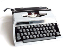 UpperDutch:Typewriter,Typewriter Silver-Reed 100, working gray portable typewriter 1970s Japan, QWERTY, Retro office. Working writing machine