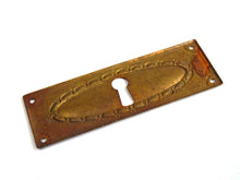 UpperDutch:Hooks and Hardware,Keyhole cover, old stamped escutcheon with an authentic patina. Cabinet hardware