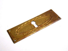 UpperDutch:Hooks and Hardware,Keyhole cover, old stamped escutcheon with an authentic patina. Cabinet hardware