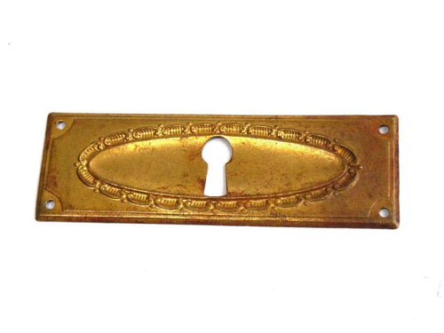UpperDutch:Hooks and Hardware,Keyhole cover, old stamped escutcheon with an authentic patina. Cabinet hardware