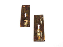 UpperDutch:Hooks and Hardware,Set of 2 Rusty key hole plates, stamped escutcheon with authentic rustic patina. Distressed keyhole covers with rust. Hardware