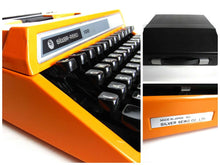 UpperDutch:Typewriter,1970's Orange typewriter, Silver-Reed SR 100 working typewriter made in 1977. Silver Seiko Co Japanese writing machine, QWERTY.