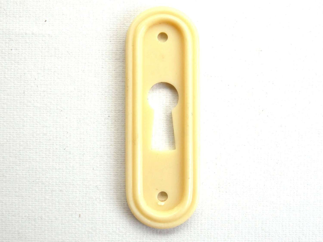 UpperDutch:Hooks and Hardware,1 Vintage Keyhole cover plastic rounded escutcheon keyhole frame / plate.