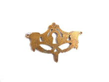 UpperDutch:Hooks and Hardware,1 (one) Keyhole cover, Antique brass escutcheon, keyhole frame,  plate, goat, ram.