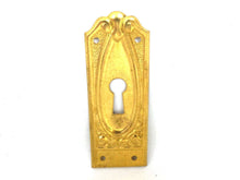 UpperDutch:Hooks and Hardware,1 (ONE) Keyhole cover. Brass Stamped keyhole frame, furniture decoration. Hardware.