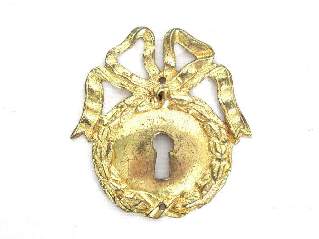 UpperDutch:,1 (ONE) French Keyhole cover, Empire Solid brass large Key Hole Frame. Oval leaf and bow shape. Restoration hardware.