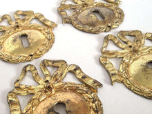 UpperDutch:,1 (ONE) French Keyhole cover, Empire Solid brass large Key Hole Frame. Oval leaf and bow shape. Restoration hardware.