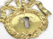 UpperDutch:,1 (ONE) French Keyhole cover, Empire Solid brass large Key Hole Frame. Oval leaf and bow shape. Restoration hardware.