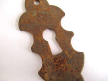 UpperDutch:,1 (One) Rusty keyhole cover, frame, metal Escutcheon