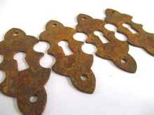 UpperDutch:,1 (One) Rusty keyhole cover, frame, metal Escutcheon