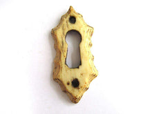 UpperDutch:Keyhole cover,Bone Keyhole cover, plate, bone escutcheon, keyhole frame.