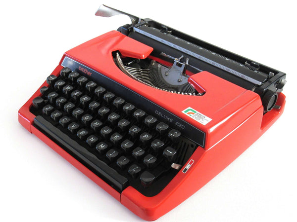 UpperDutch:Typewriter,Brother Deluxe 220 working typewriter. Red metal body, two tone ink ribbon. Portable writing machine. Office decor QWERTY layout