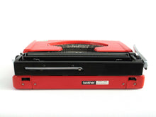 UpperDutch:Typewriter,Brother Deluxe 220 working typewriter. Red metal body, two tone ink ribbon. Portable writing machine. Office decor QWERTY layout