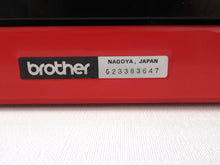 UpperDutch:Typewriter,Brother Deluxe 220 working typewriter. Red metal body, two tone ink ribbon. Portable writing machine. Office decor QWERTY layout