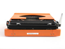UpperDutch:Typewriter,Silver-Reed 100 working typewriter made in 1976. 1970's Orange typewriter, Silver Seiko Co Japanese QWERTY writing machine